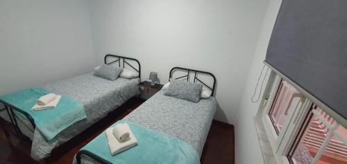 Postel nebo postele na pokoji v ubytování PISO IRIA
