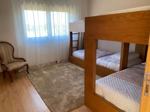 Ένα ή περισσότερα κρεβάτια σε δωμάτιο στο Casa do Vale Vintém