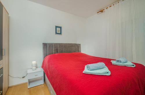 Postel nebo postele na pokoji v ubytování Apartmani M