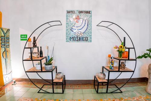 a room with three shelves with plants on them at Hotel Boutique Mosaico in Granada