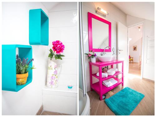 Un baño con un tocador rosa y un espejo rosa. en Villa Romansa near Split- heated pool peace, bbq, en Krušvar