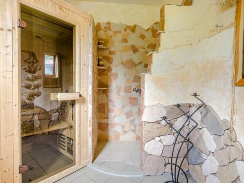 a room with a stone wall with a doorway at Apartament Vip Marysieńka in Kąty Rybackie