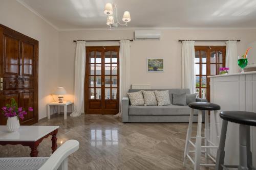 a living room with a couch and a table at Elena Hara in Alikanas