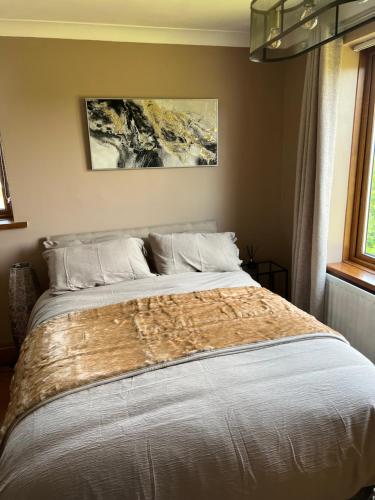 Ліжко або ліжка в номері Cherry blossom lodge