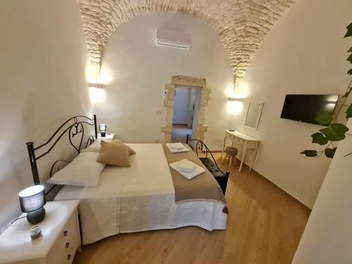 Postel nebo postele na pokoji v ubytování La Dimora nel Borgo