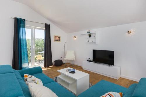 Μια τηλεόραση ή/και κέντρο ψυχαγωγίας στο Apartment Green Oase