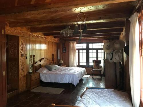 Ένα ή περισσότερα κρεβάτια σε δωμάτιο στο La casa de los volcanes / Volcano House