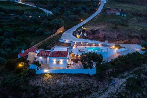 an aerial view of a house with a road at Villa Koukounaria in Skopelos Town