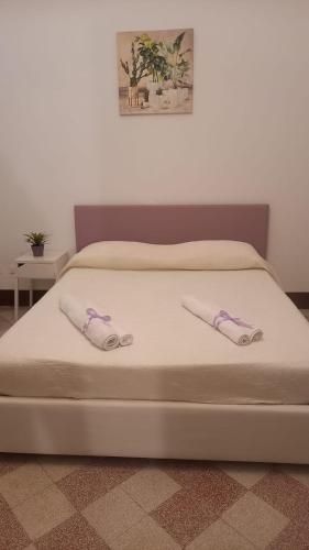 Letto o letti in una camera di Le stanze di Regina Margherita
