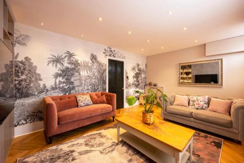 a living room with two couches and a tv at Luxury Central Home - Parking & EV point, Superking bed in Canterbury