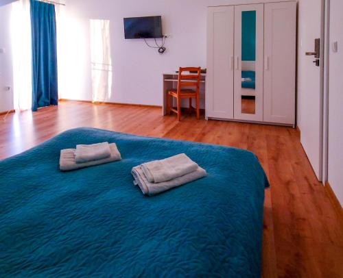 Łóżko lub łóżka w pokoju w obiekcie Ararat
