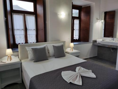 Letto o letti in una camera di Achilleas Pension