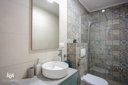 Bilik mandi di Apartments & Rooms ARCH