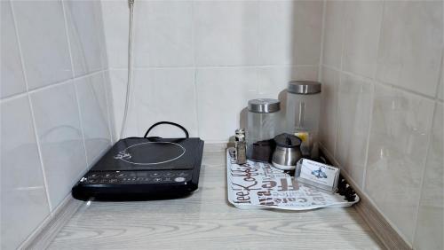 a kitchen counter with a toaster and other kitchen items at U Iwony in Nowęcin