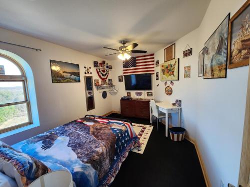 a bedroom with a bed and an american flag at The Starlight Tower Manor, River, Arcades, Observatory, Theater in Fort Atkinson