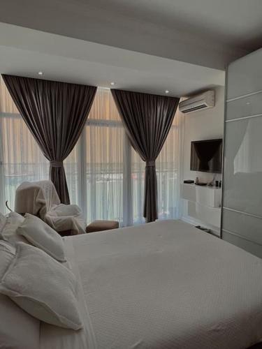 Gulta vai gultas numurā naktsmītnē Sunshine apartment