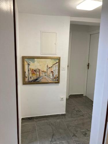 a hallway with a painting on a wall at CALYPSO in Biograd na Moru