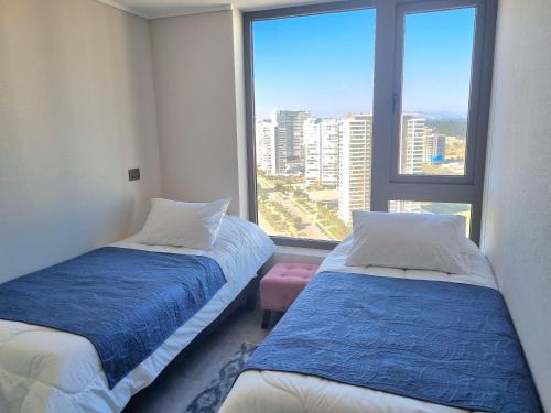 Кровать или кровати в номере DEPARTAMENTO CON VISTA DESPEJADA AL MAR