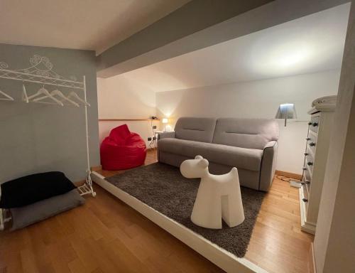 a living room with a couch and a room with a table at My Place Your Place in Corniglia
