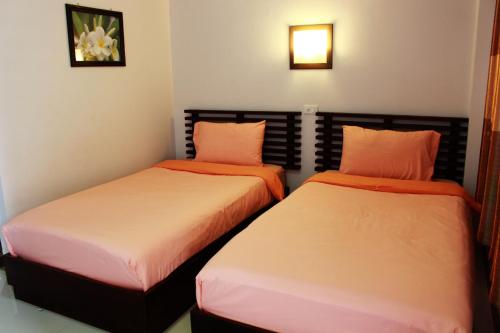 Postel nebo postele na pokoji v ubytování Pornkasem House