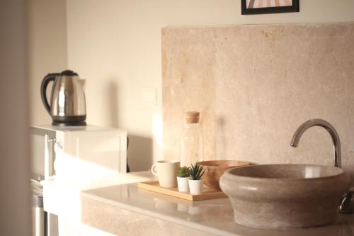 a kitchen counter with a sink and a bottle at Seven Stays Sidi Abd El-Rahman in El Alamein