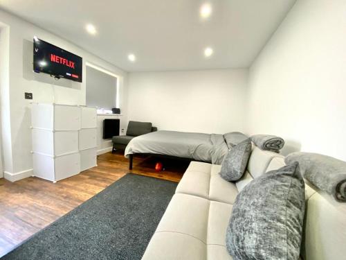 a living room with a couch and a bed at Kyle house in Longley