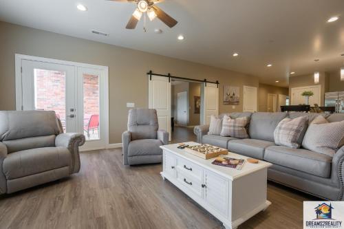 a living room with a couch and two chairs and a table at Walk-in - Close to 76 Strip - Resort Amenities - FREE TICKETS INCLUDED - FH-G203 in Branson