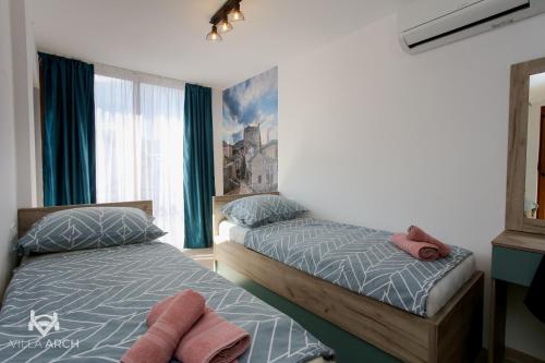 Katil atau katil-katil dalam bilik di Apartments & Rooms ARCH