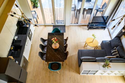 an overhead view of a living room with a table at Körös-parti Terasz Vendégház in Békésszentandrás