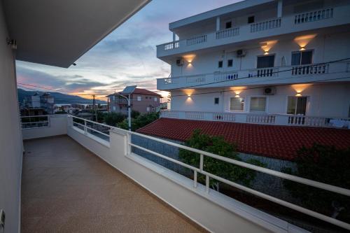 a balcony of a building with a red roof at Vila Era Ksamil in Ksamil