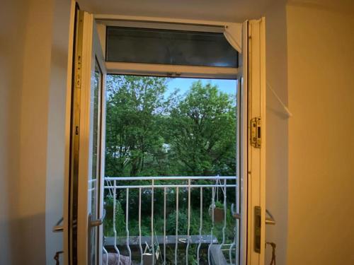 an open door with a view of a balcony at Bowie's Abode in Sowerby Bridge