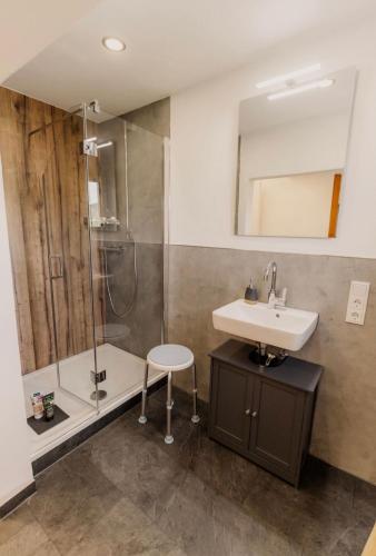a bathroom with a sink and a shower at Ferienhaus Scheid in Bremm