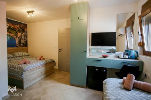 Katil atau katil-katil dalam bilik di Apartments & Rooms ARCH
