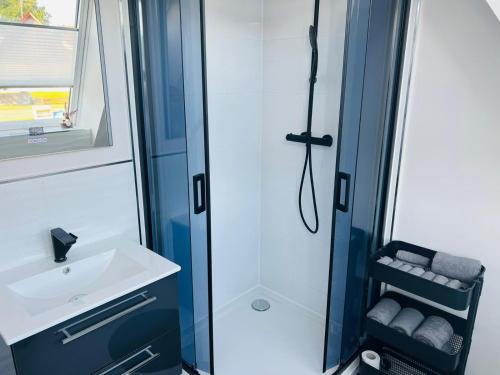 a bathroom with a shower and a sink at apartment4me in Burgau
