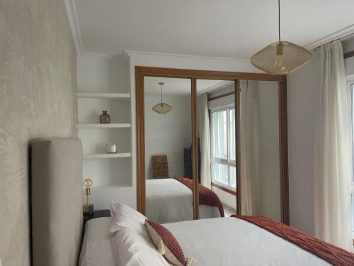 Ένα ή περισσότερα κρεβάτια σε δωμάτιο στο Apartamento Oriente