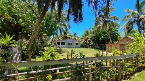 a house in the middle of a yard with a fence at Villa Ste Marie in Sainte Marie