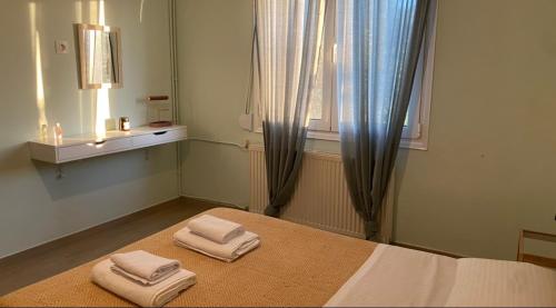 Ένα ή περισσότερα κρεβάτια σε δωμάτιο στο Theros Garden House