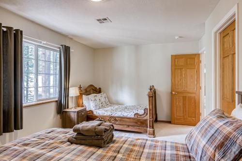 a bedroom with a bed and a window at Montgomery Estates Ski & Beach Haven in South Lake Tahoe