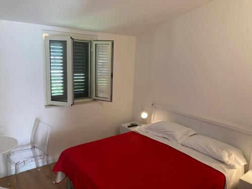 Postel nebo postele na pokoji v ubytování Villaggio Turistico Scialmarino