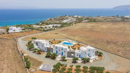 an aerial view of a villa with the ocean in the background at White Cliff 4 - Cycladic Home in Ambelas