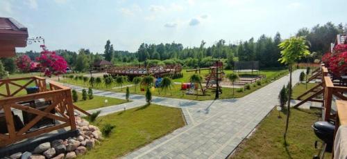 a park with a playground at ZIELONA DOLINA - kompleks dla rodzin z dziećmi in Mikołajki