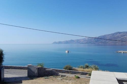 a view of a large body of water with a boat at Sunny Kotronas in Kótronas