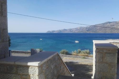 a view of the ocean from a house at Sunny Kotronas in Kótronas