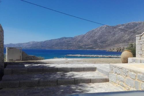 a view of a lake with mountains in the background at Sunny Kotronas in Kótronas