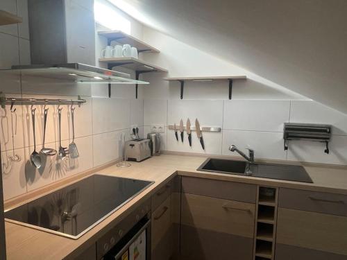 a kitchen with a sink and a counter top at Buxtehude*Wohnung*100qm*6 Schlafplätze*NEU* in Buxtehude