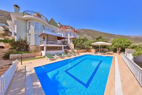 a swimming pool in front of a house at 3 House Apart in Kas