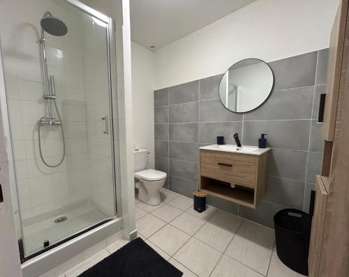 a bathroom with a shower and a sink and a mirror at Havre de tranquillité à 13Kms des plages de Royan in Le Gua