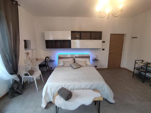 a bedroom with a bed with a blue light at Tirano Express luxury Apartment in Tirano
