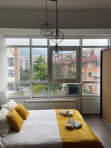 Postel nebo postele na pokoji v ubytování Kamche apartment