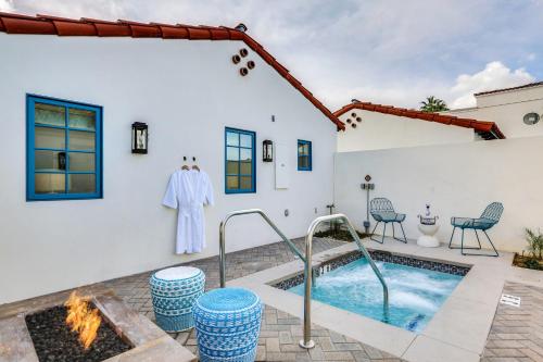 a villa with a swimming pool and a house at La Serena Villas in Palm Springs